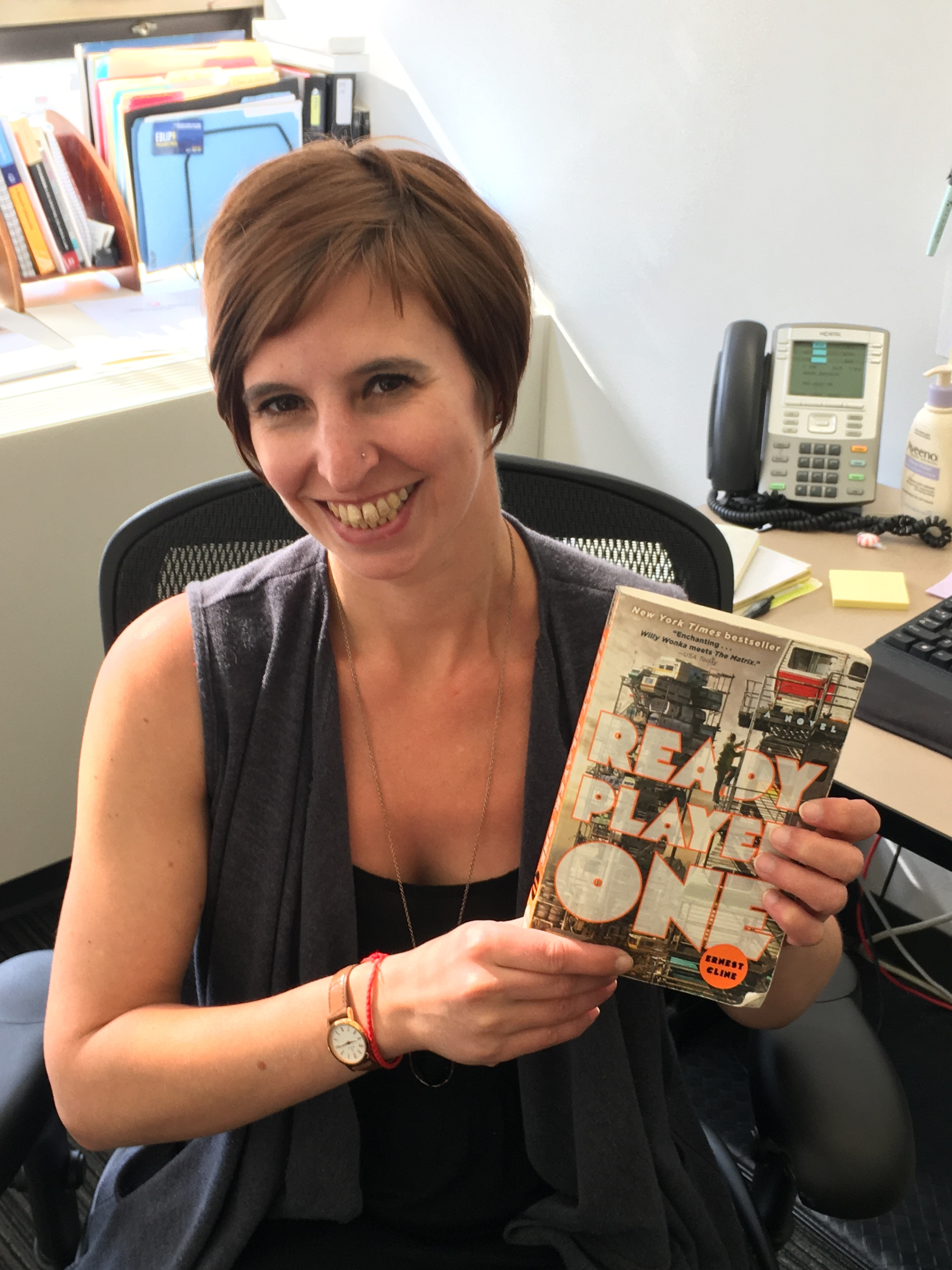 Stacy Stanislaw holds a copy of the novel 'Ready Player One'